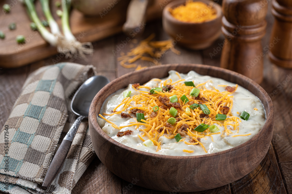 Cream of potato soup with bacon, cheese and green onions Cream of potato soup with bacon, cheese and green onions