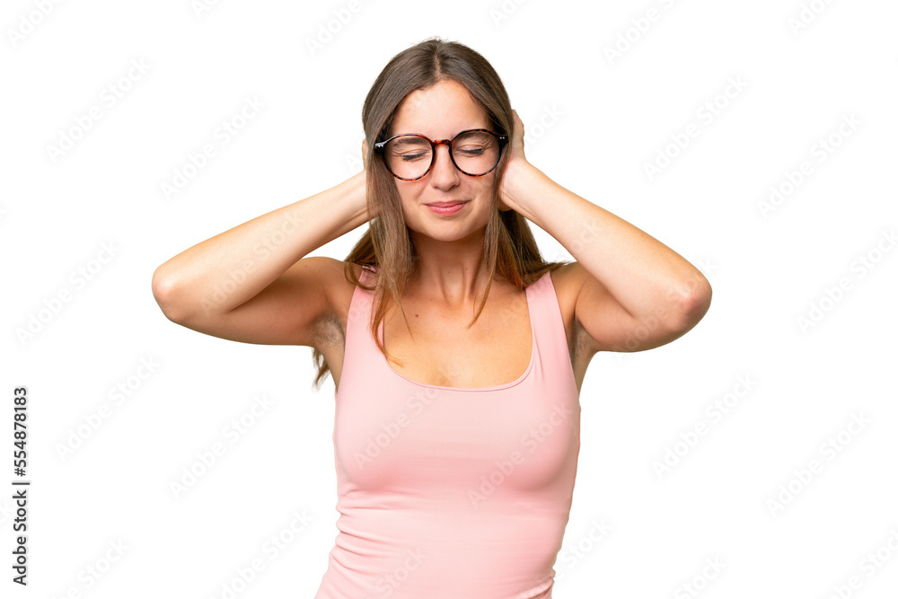 Young pretty woman over isolated background frustrated and covering ears Young pretty woman over isolated background frustrated and covering ears
