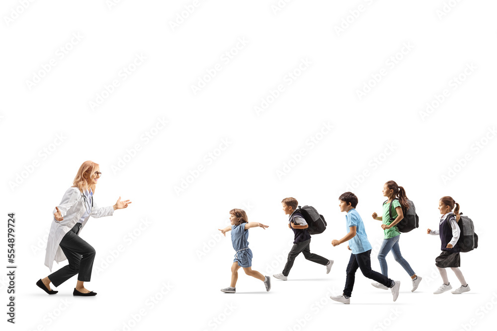 Group of children running towards a female doctor
