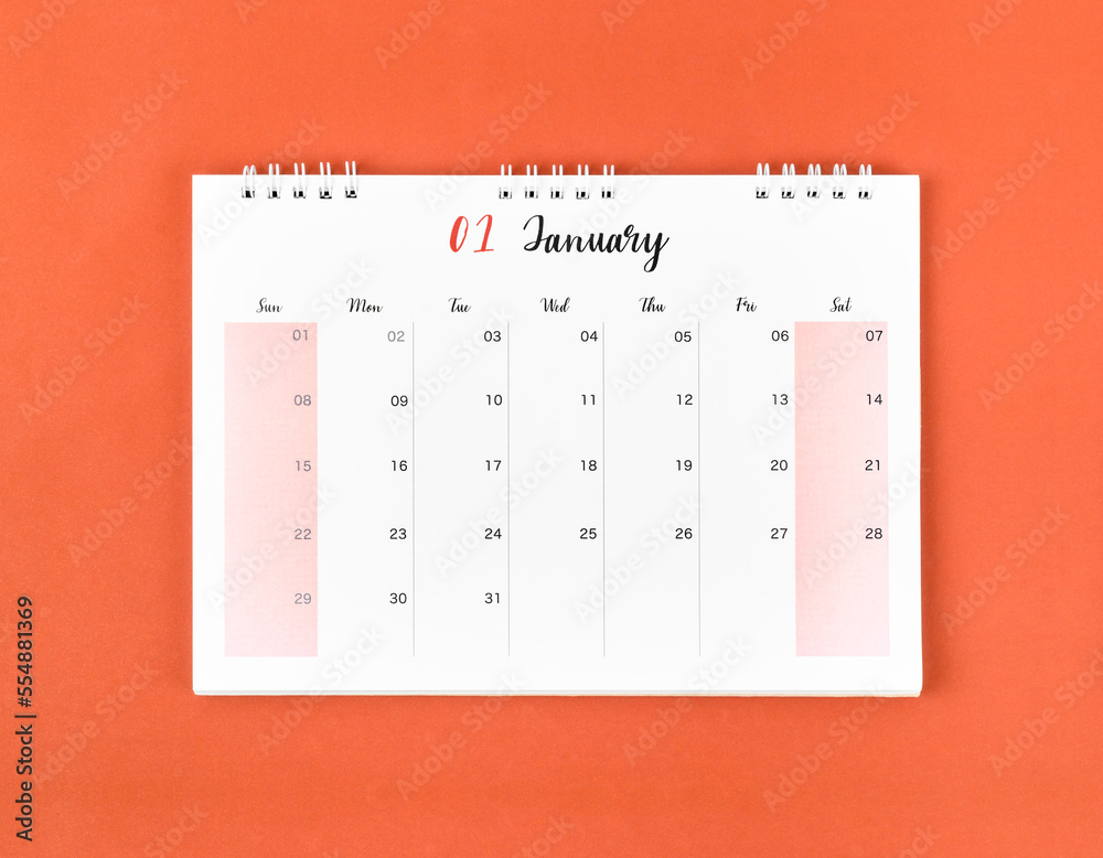 The January 2023 calendar desk for the organizer to plan and reminder on red background. The January 2023 calendar desk for the organizer to plan and reminder on red background.