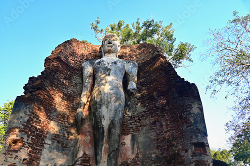 Standing Buddha of Wat Phra Si Iriyabot at Kamphaeng Phet Historical Park photo