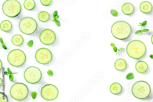 Fresh cucumber and mint on a white background with copy space, overhead flat lay shot. Healthy organic food banner design with a place for text