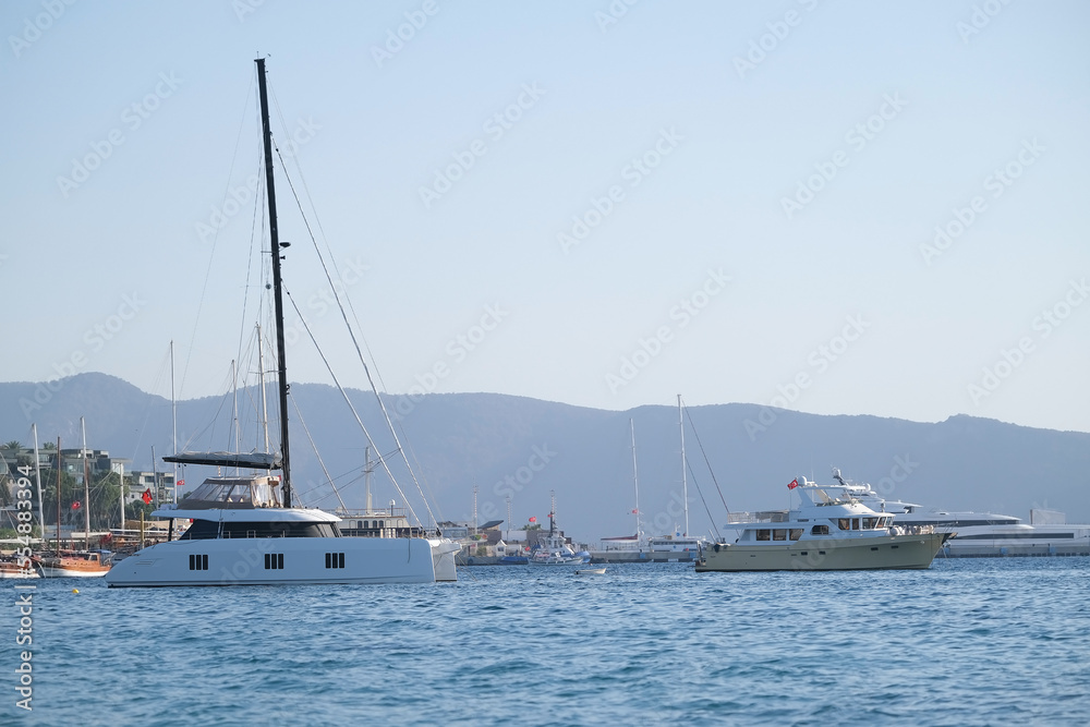 Sailing catamaran is anchored in the sea
Sailing catamaran is anchored in the sea