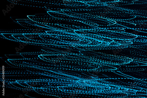 Imagenes de luces color azul abstractas en forma de ondas en un fondo negro