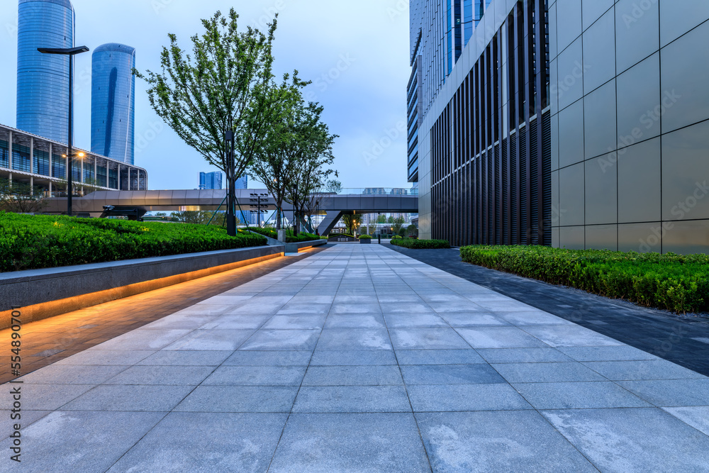 Empty square floor and modern city buildings in Hangzhou, China. Empty square floor and modern city buildings in Hangzhou, China.