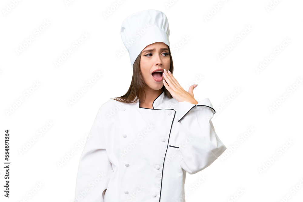 Young chef caucasian woman over isolated background yawning and covering wide open mouth with hand Young chef caucasian woman over isolated background yawning and covering wide open mouth with hand
