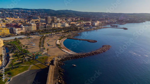 Panoramic view of the city of Civitavecchia with the adjoining tourist port and Forte Michelangelo. Emerald sea and view with tropical palm trees.