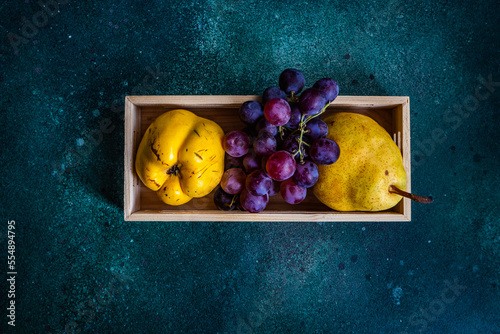 Box with ripe organic fruits photo