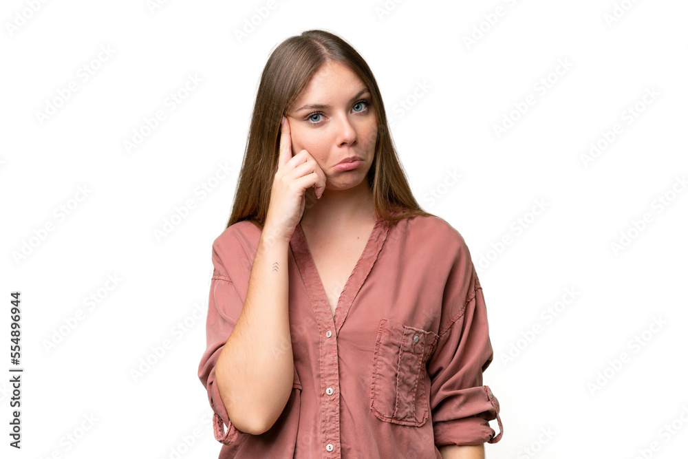 Young beautiful blonde woman over isolated background thinking an idea