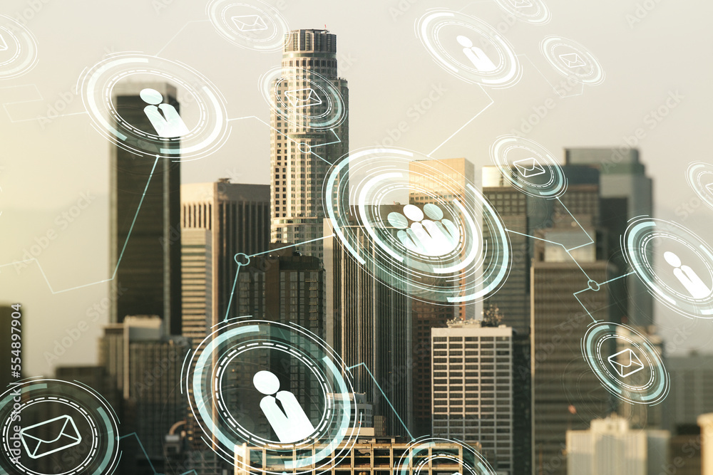Double exposure of social network icons hologram on Los Angeles office