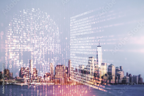Double exposure of abstract virtual creative code skull hologram on New York city skyscrapers background. Malware and cyber crime concept