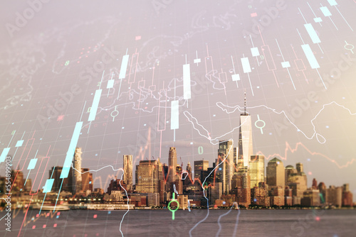 Double exposure of abstract creative financial chart hologram and world map on New York city skyscrapers background, research and strategy concept