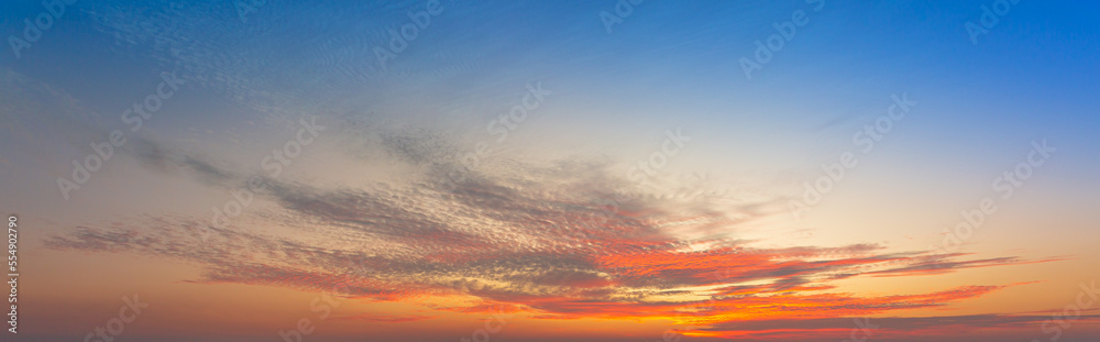 clouds and orange sky,Real amazing panoramic sunrise or sunset sky with gentle colorful clouds. Long panorama, 