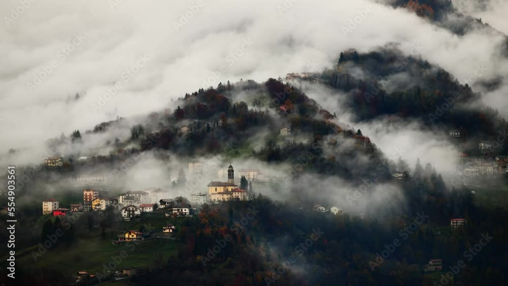 Village of Italian Alps with church tar the clouds Village of Italian Alps with church tar the clouds