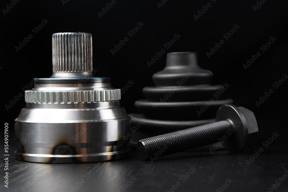 Car CV joint. Drive shaft connection on black background. New constant