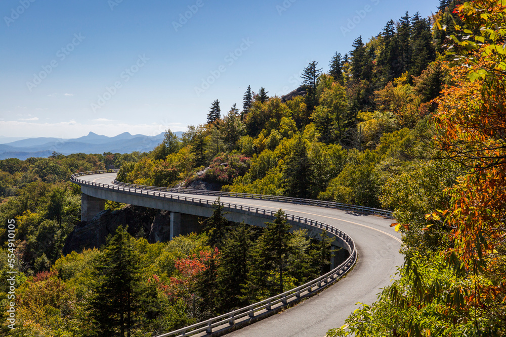 Linn Cove Viaduct curves through colorful autumn trees along the Blue Ridge Parkway; North Carolina, United States of America Linn Cove Viaduct curves through colorful autumn trees along the Blue Ridge Parkway; North Carolina, United States of America