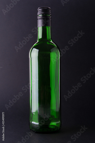 Wine bottle close up  on a black background