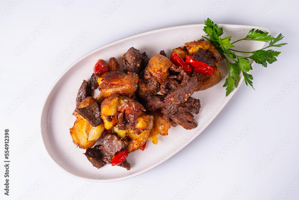 baked potatoes with meat and tomatoes on a white background baked potatoes with meat and tomatoes on a white background