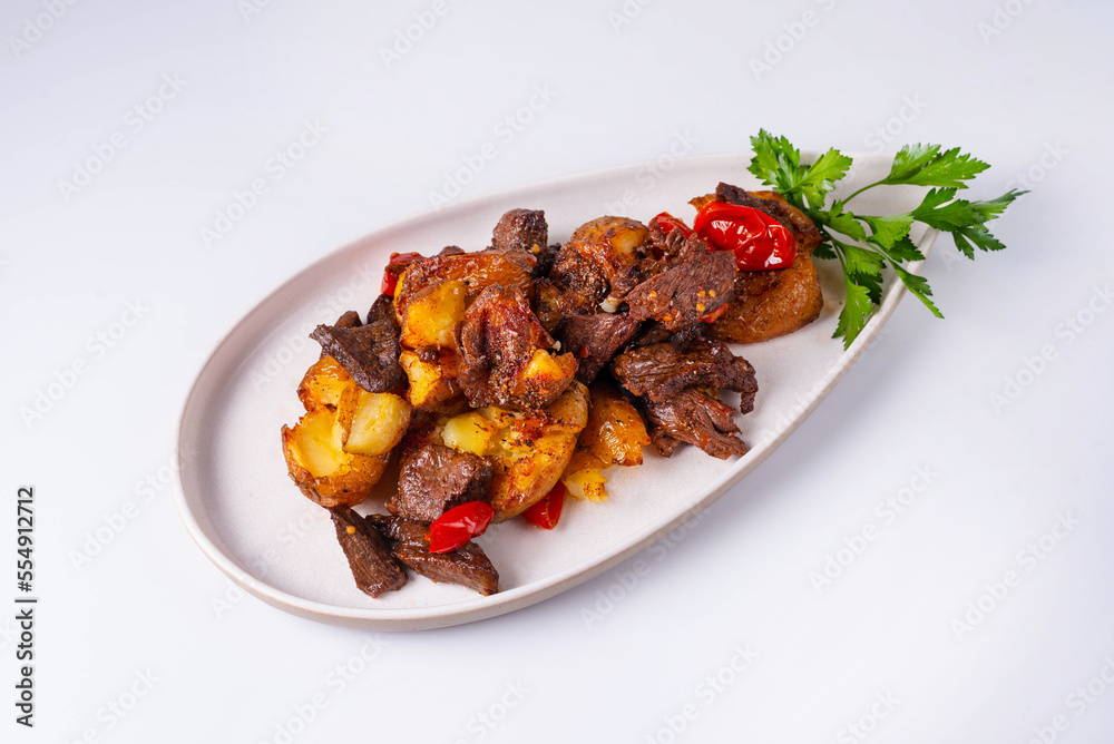 baked potatoes with meat and tomatoes on a white background baked potatoes with meat and tomatoes on a white background