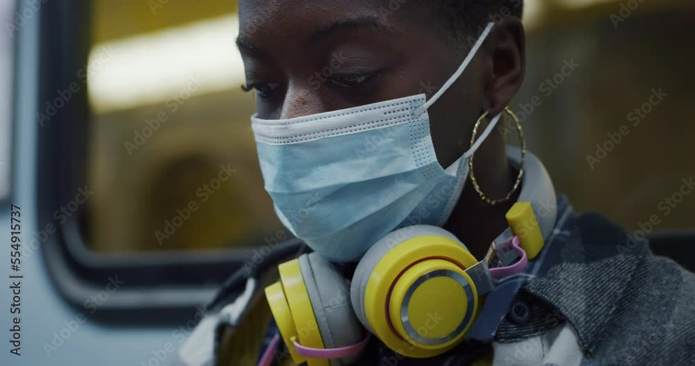 Young Black Woman With Medical Mask in Subway Young Black Woman With Medical Mask in Subway