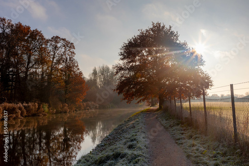 Winter landscape view of white frost in morning, Nature path along the Kromme Rijn river (Crooked Rhine) in Rhijnauwen, Bunnik is a municipality and a village in the province of Utrecht Netherlands. photo