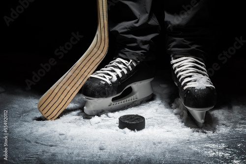 Canvas Print ice hockey. closeup of player skates with stick and puck