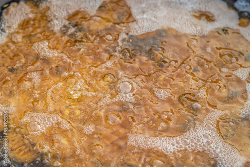 hot boiling refined oil from flat angle photo