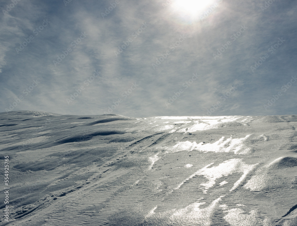 Scenic landscape. Surface of a mountain covered with snow. Sunlit snowy surface. Photographed in Combai, Treviso, Italy. Scenic landscape. Surface of a mountain covered with snow. Sunlit snowy surface. Photographed in Combai, Treviso, Italy.
