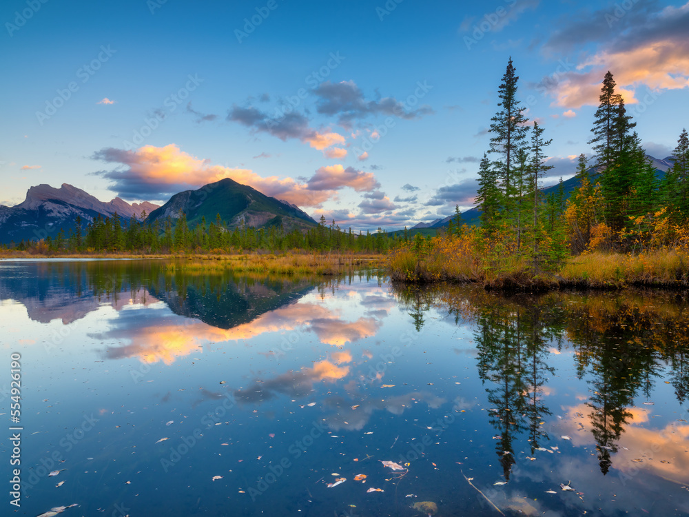 Vermilion lakes. Landscape during sunset. A lake in a mountain valley. Fall view. Mountains and forest. Natural landscape. Banff National Park, Alberta, Canada.