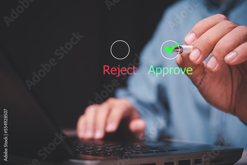 The guy selects green approve from the options on the virtual screen
