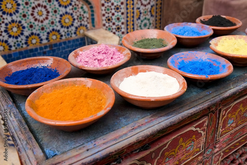 Marrakech, Morocco Clay bowls of spices and bluing with tile background. photo