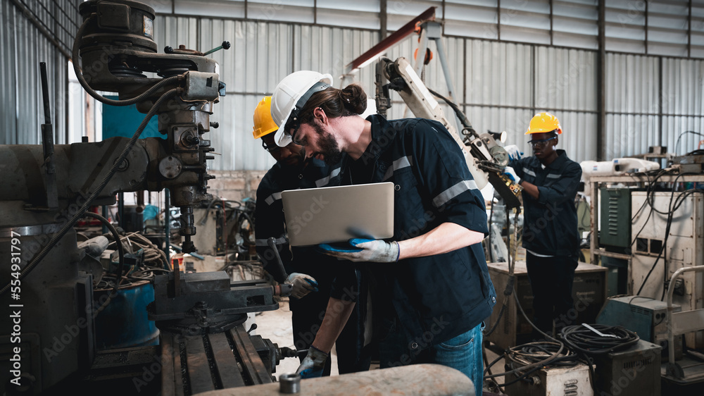 Industrial engineers inspect and perform maintenance on the machines at factory machines. Industrial engineers inspect and perform maintenance on the machines at factory machines.