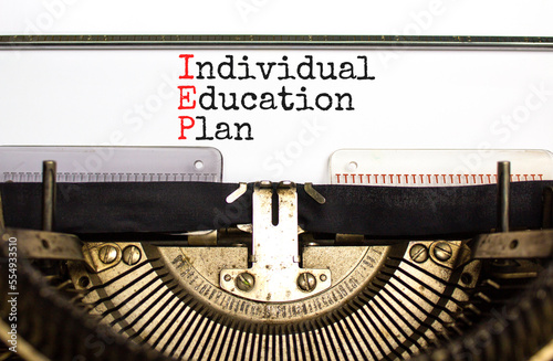 IEP individual education plan symbol. Concept words IEP individual education plan typed on old retro typewriter. Beautiful white background. Business IEP individual education plan concept. Copy space. photo