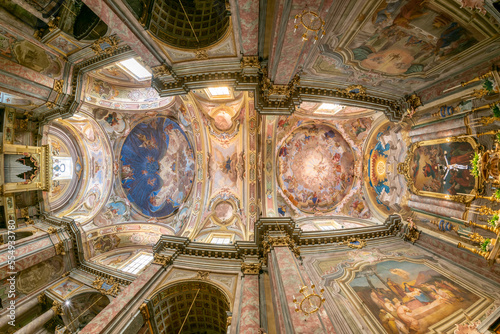 Carrù, Piedmont, Italy - May 17, 2022: internal view of the parish church of Maria Vergine Assunta (Virgin Mary of the Assumption) with frescoed vaults, fish eye view