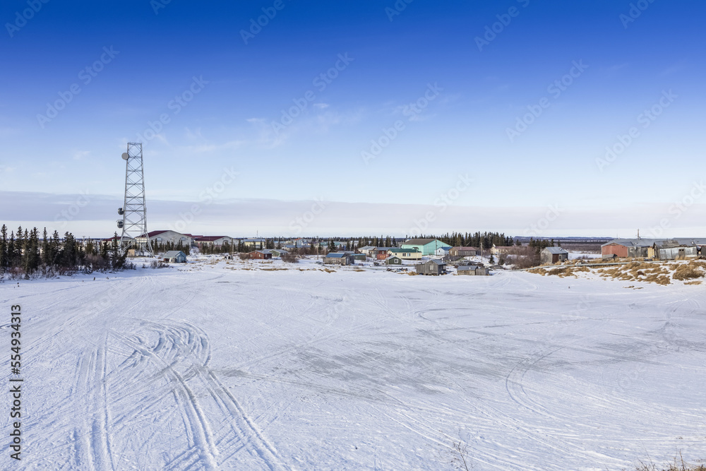Winter scene of communications tower and village of Noorvik, Alaska; Noorvik, Alaska, United States of America Winter scene of communications tower and village of Noorvik, Alaska; Noorvik, Alaska, United States of America
