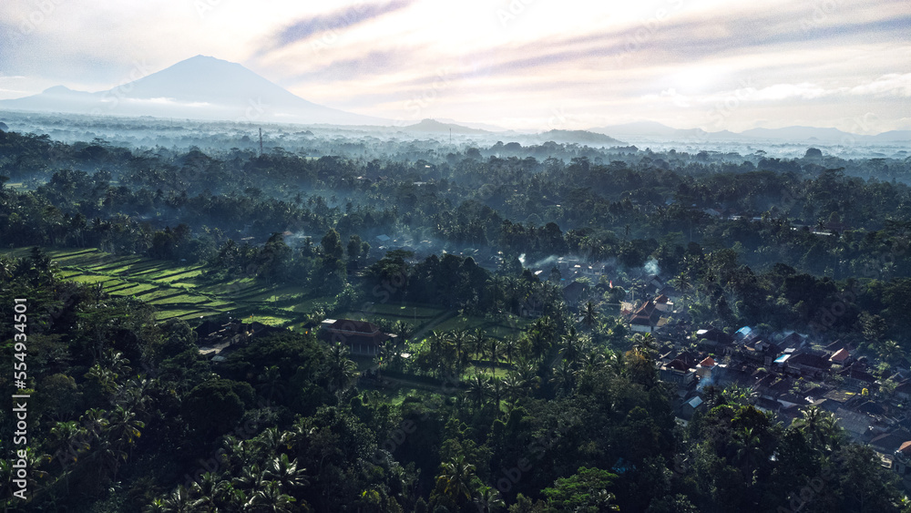 Beautiful hazy morning in the jungle near a volcano and rice paddies