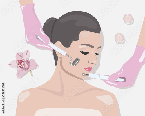 A doctor cosmetologist makes a microcurrent facial therapy to a young woman with a device in a beauty wellness salon.Cosmetology and professional skin care.