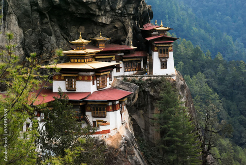 Taktsang Lhakhang, known as The Tiger's Nest, is a monastery clinging to a vertical granite cliff.; Paro, Bhutan photo