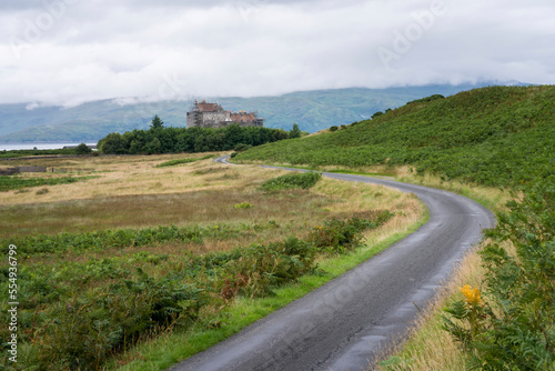 A winding road leads to Duart Castle on the Isle of Mull, Scotland; Isle of Mull, Scotland photo