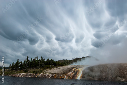 Mammatus clouds over the steamy cliffs and thermal runoff channels along the Firehole River at the Midway Geyser Basin in Yellowstone National Park; Wyoming, United States of America photo