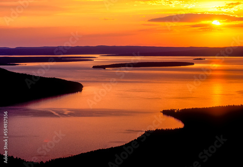 A golden sunset reflected off the surface of Yellowstone Lake.