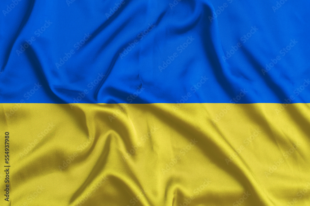 Ukrainian flag closeup. silk texture. waving country flag. Ukrainian flag closeup. silk texture. waving country flag.