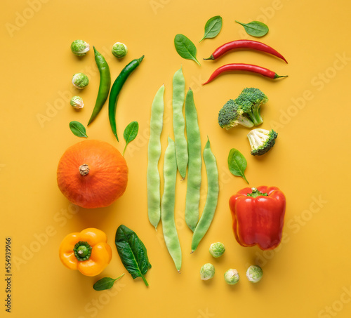 Fototapeta Naklejka Na Ścianę i Meble -  Set of various vegetables for healthy and diet food on a yellow background top view