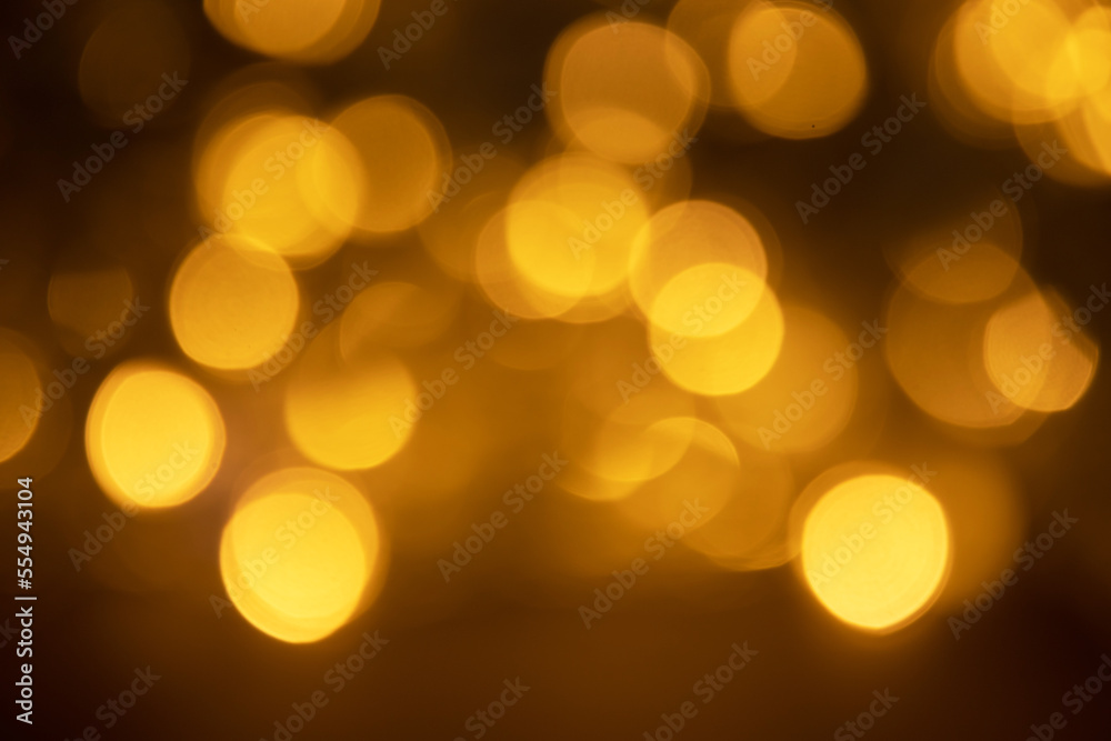 Abstract background of blurred yellow lights for design. Lights bokeh dis focus. Christmas background, copy space Abstract background of blurred yellow lights for design. Lights bokeh dis focus. Christmas background, copy space