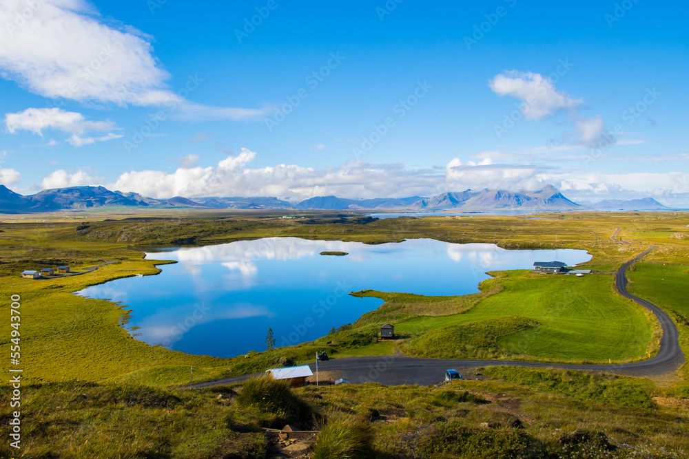 Green Landscape with Lake and Sky with Clouds Beautiful Helgafell, Iceland with Hills and Ocean Green Landscape with Lake and Sky with Clouds Beautiful Helgafell, Iceland with Hills and Ocean