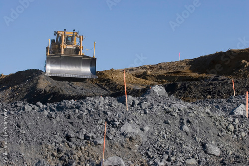 A bulldozer grading a new road.; Petaluma, California. photo