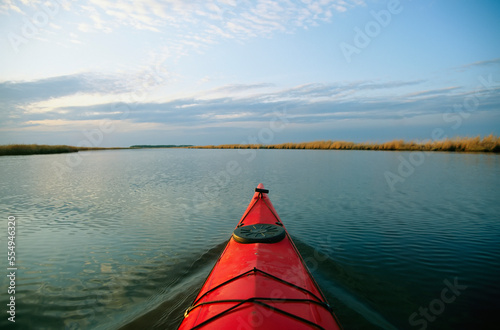 Seakayak bow parts the rippled water of the Blackwater River.; Chesapeake Bay, Maryland. photo