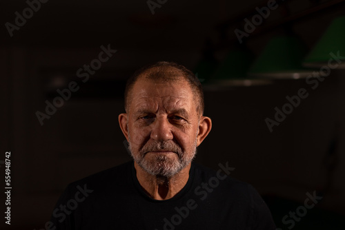 portrait of an elderly man in the low key