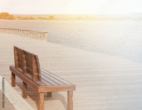 Wooden walkway on the beach of Leucate in the south of France in Languedoc Roussillon in France. Wooden bench with space for text.  © Karen Images