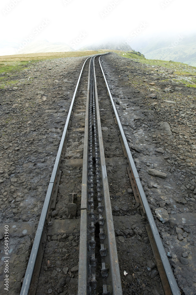 Train tracks on Mount Snowdon in Wales, United Kingdom; Mount Snowdon, Wales, United Kingdom Train tracks on Mount Snowdon in Wales, United Kingdom; Mount Snowdon, Wales, United Kingdom